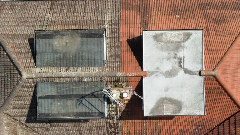 Zoom in spot the tile behind the chimney. 